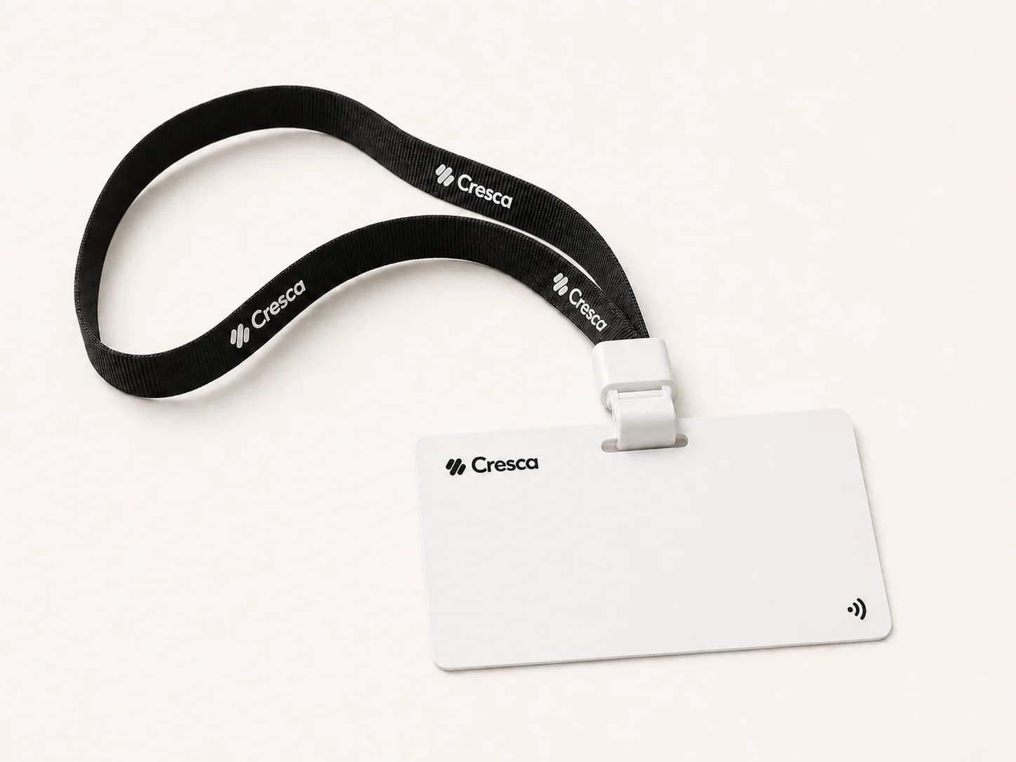 A white Cresca Card clipped to a black Cresca lanyard